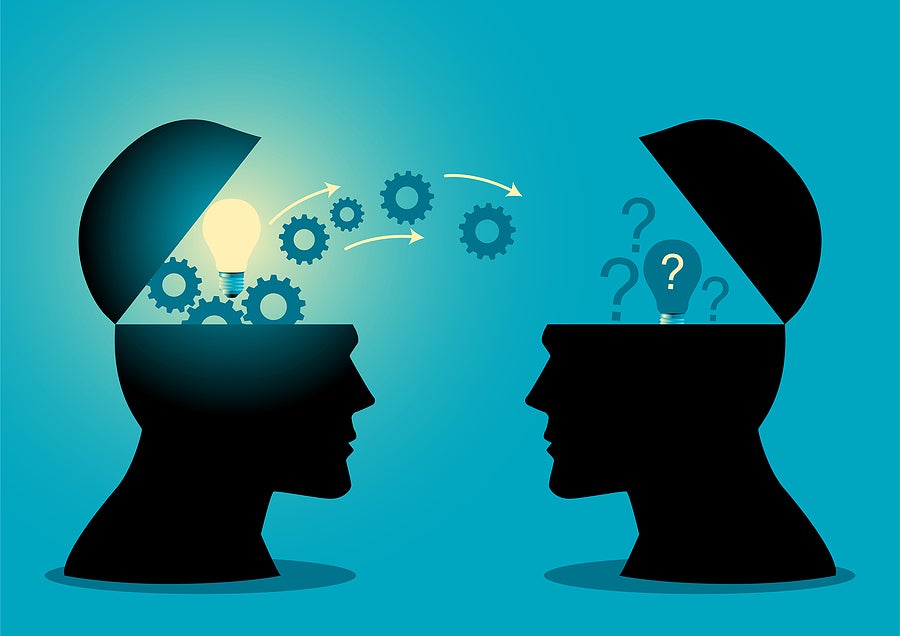 abstract image of two people's heads transferring knowledge
