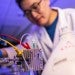 Graduate student working on his lab project